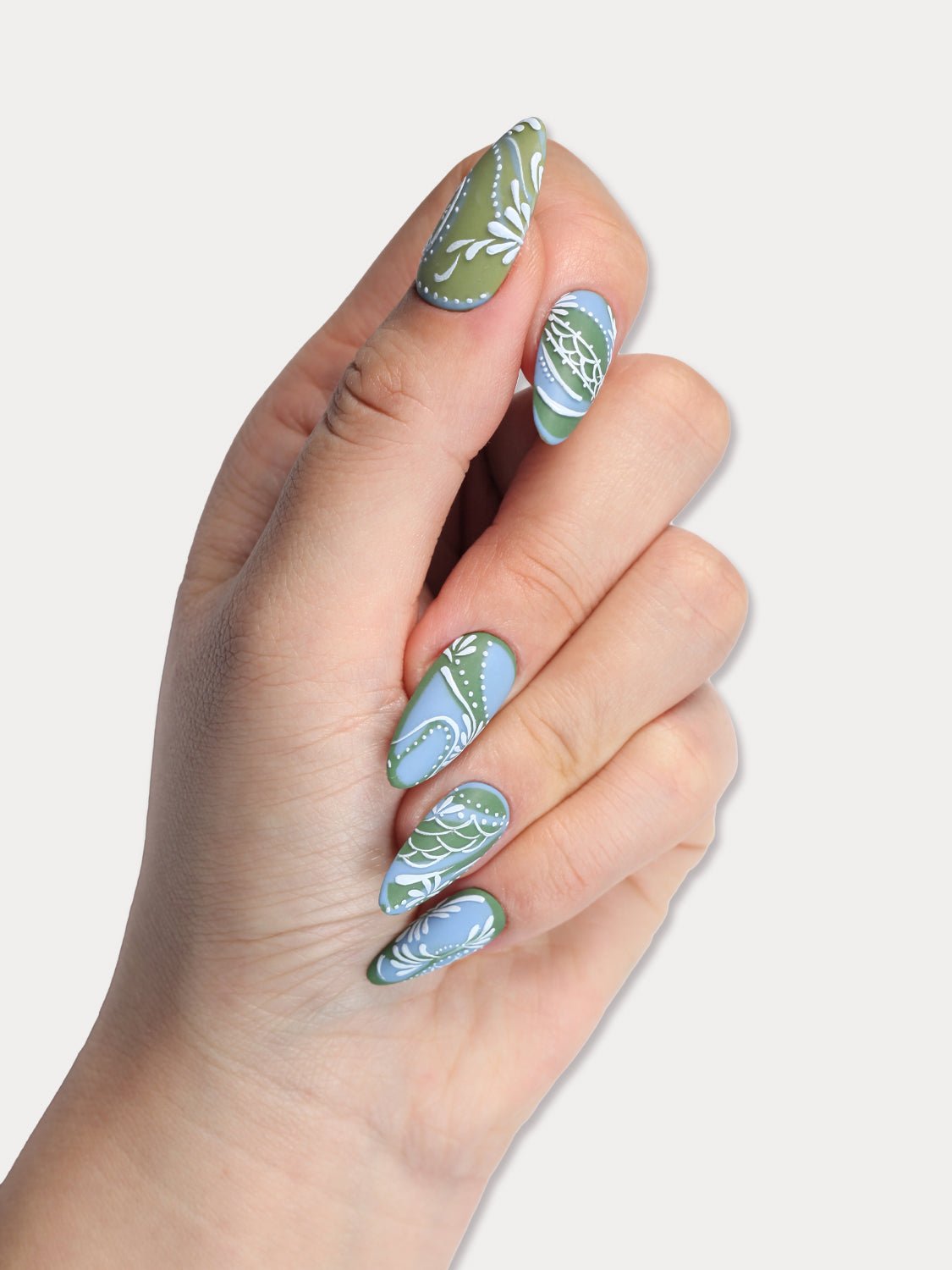 MIEAP Boho Lace press on nail set is meticulously hand-painted by master nail designers. The intricate Bohemian-inspired patterns showcase the artists' exceptional craftsmanship. With lace-like Boho patterns and a vintage blue-green base color, these nails possess a unique and charming appeal. #MIEAP #MIEAPnails #pressonnail #falsenail #acrylicnail #nails #nailart #naildesign #nailinspo #handmadenail #autumnnail #nail2023 #graduationnail #luxurynail #shortnail #ovalnail #mattenail  #datingnail #promnail