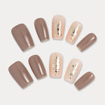 MIEAP Brown Gold Foil press on nail set provides a simple, office-ready look, featuring a square shape design with brown and gold lines for subtle styling. It includes 4 stunning acrylic nails adorned with gold foil and delicate shell details, adding a touch of elegance to your fingertips. #MIEAP #MIEAPnails #pressonnail #falsenail #acrylicnail #nails #nailart #naildesign #nailinspo #handmadenail #autumnnail #nail2023 #graduationnail #classicnail #squarenail #shortnail #brownnail