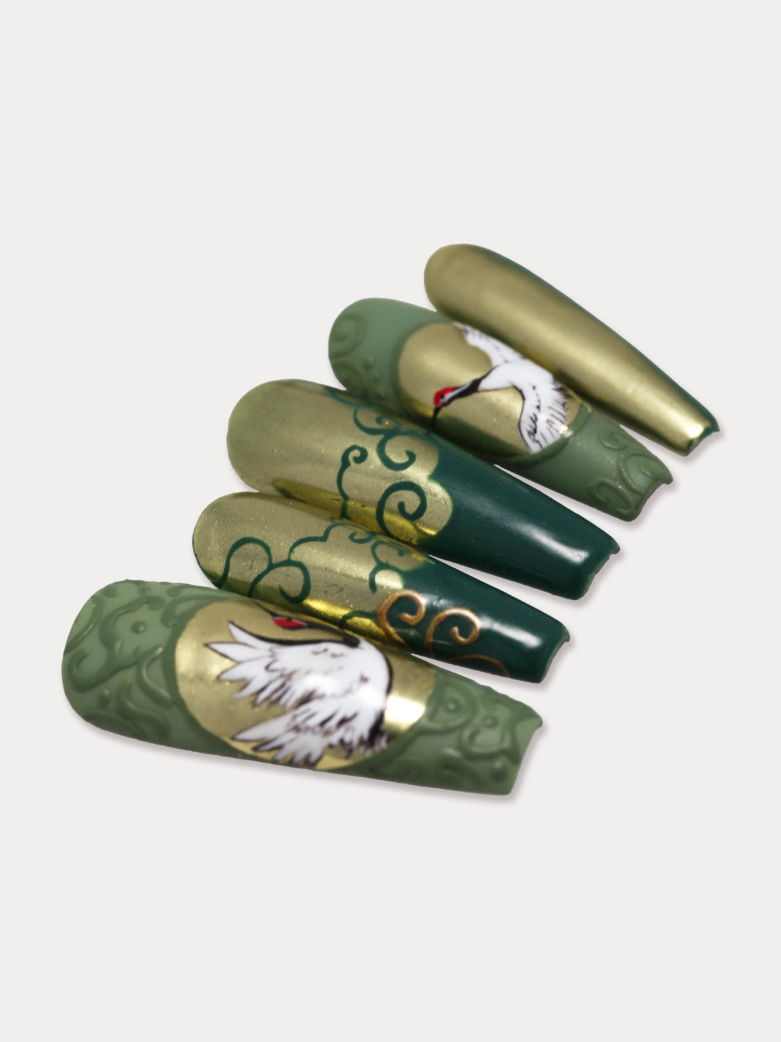MIEAP Crane press on nail set is a Chinese-inspired design. It showcases a traditional Chinese green color, golden auspicious cloud patter and hand-painted Chinese classical crane design. #MIEAP #MIEAPnails #pressonnail #falsenail #acrylicnail #nails #nailart #naildesign #nailinspo #handmadenail #nail2023 #chinesestylenail #longnail #coffinnail #goldnail