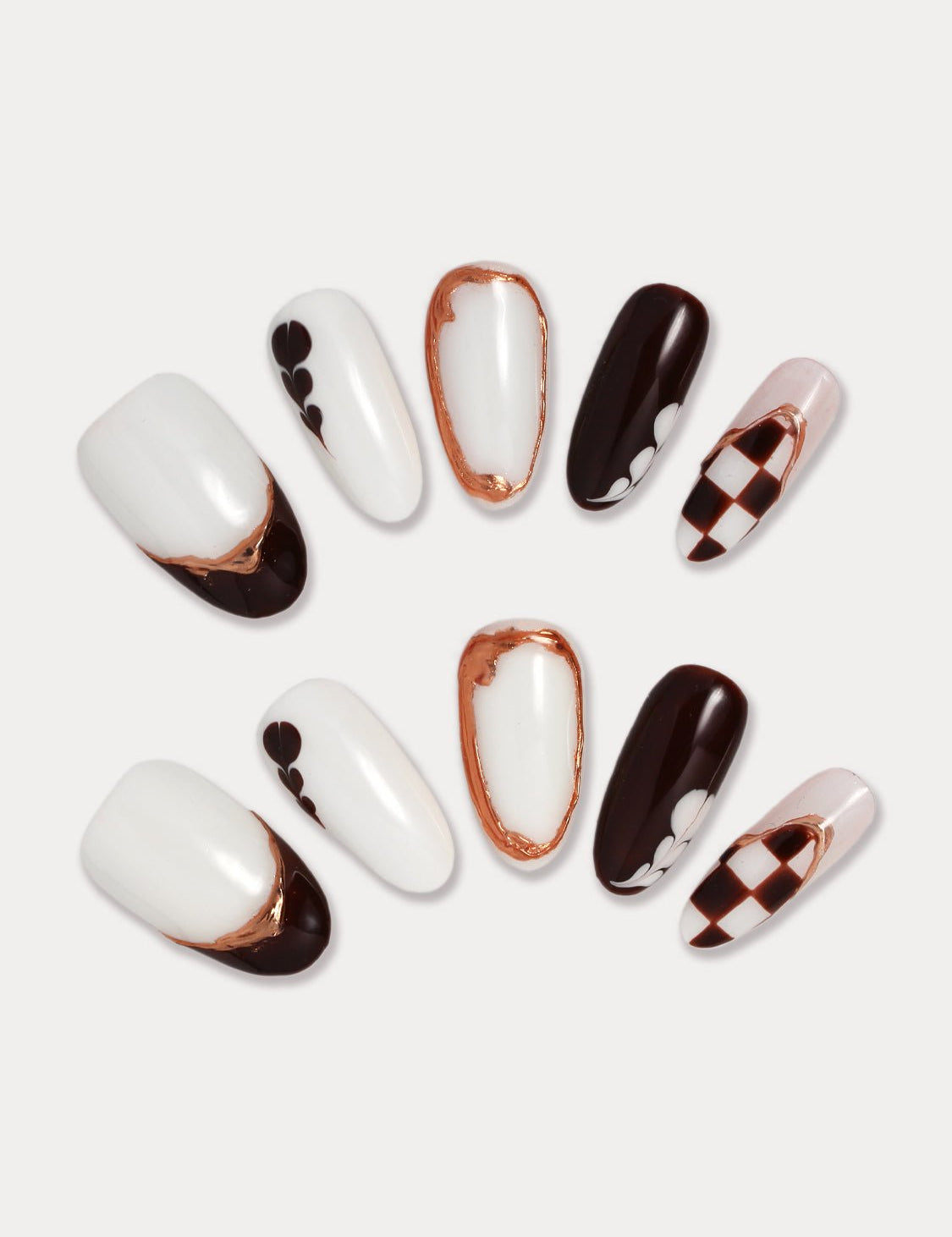 MIEAP Dark Chocolate Checkerboard press on nail set features a combination of chocolate and milk white designs. Each of the five fingers showcases a unique hand-painted nail design. The index and ring fingers are adorned with milk latte arts, creating a smooth and velvety texture. #MIEAP #MIEAPnails #pressonnail #falsenail #acrylicnail #nails #nailart #nailinspo #handmadenail #winternail #nail2023 #graduationnail #shortnail #ovalnail #whitenail
