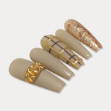 MIEAP Glitter Chrome Powder press on nail set features a specially curated base color in a unique gray-green shade, perfectly complemented by the dazzling gold glitter. The highlight of the design is the 3D ring-shaped design with gold chrome powder. #MIEAP #MIEAPnails #pressonnail #falsenail #acrylicnail #nails #nailart #naildesign #nailinspo #handmadenail #summernail #autumnnail #nail2023 #graduationnail #glitternail #3Dnail