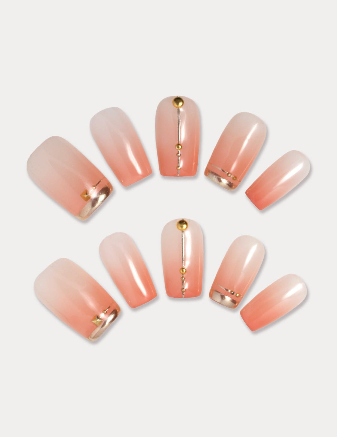 MIEAP Orange Pink Ombre press on nail set features an orange-pink ombre with square shape. The minimal gold lines and studs on the simple color bring a unique and stylish element to these artificial nails, making them anything but ordinary. #MIEAP #MIEAPnails #pressonnail #falsenail #acrylicnail #nails #nailart #naildesign #nailinspo #handmadenail #summernail #nail2023 #graduationnail #classicnail #squarenail #shortnail #ombrenail