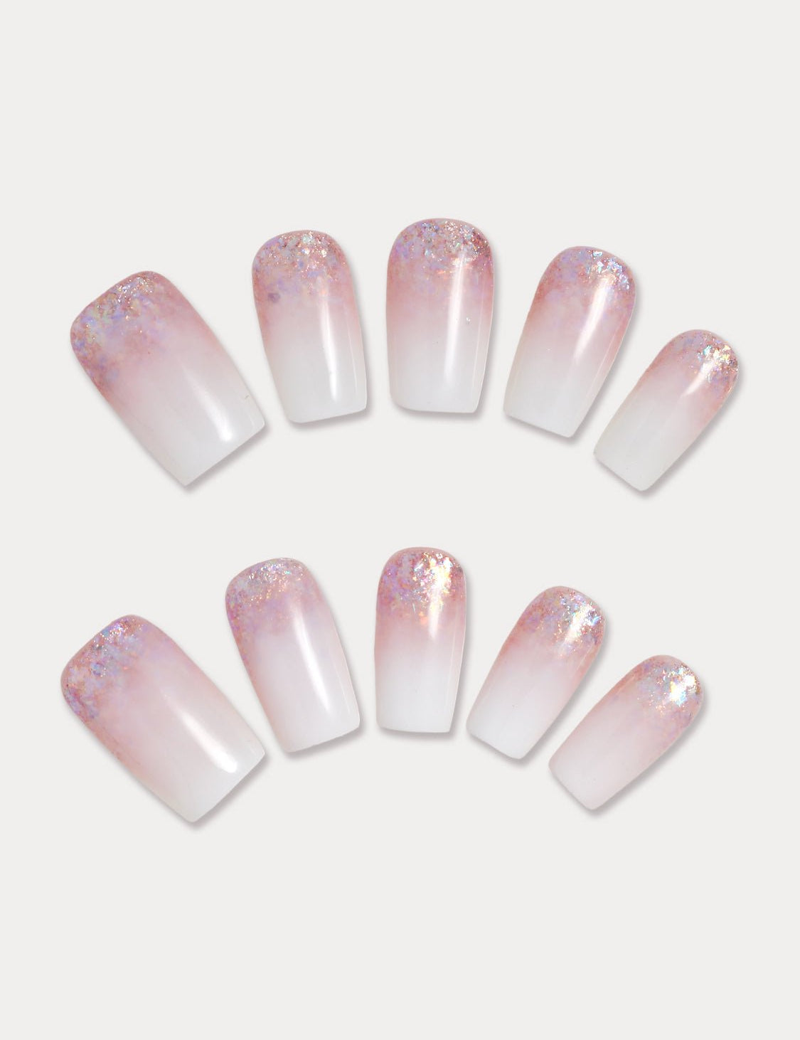 MIEAP Pink Ombre Glitter press on nail set combines the classic white ombre design with pink glitter gel, creating a beautiful dual-color ombre effect. The nails transition naturally from a white base at the fingertips to a pink glitter gel near the cuticles. #MIEAP #MIEAPnails #pressonnail #falsenail #acrylicnail #nails #nailart #naildesign #nailinspo #handmadenail #summernail #nail2023 #graduationnail #weddingnail #glitternail #whitenail #pinknaial #ombrenail #datingnail #promnail
