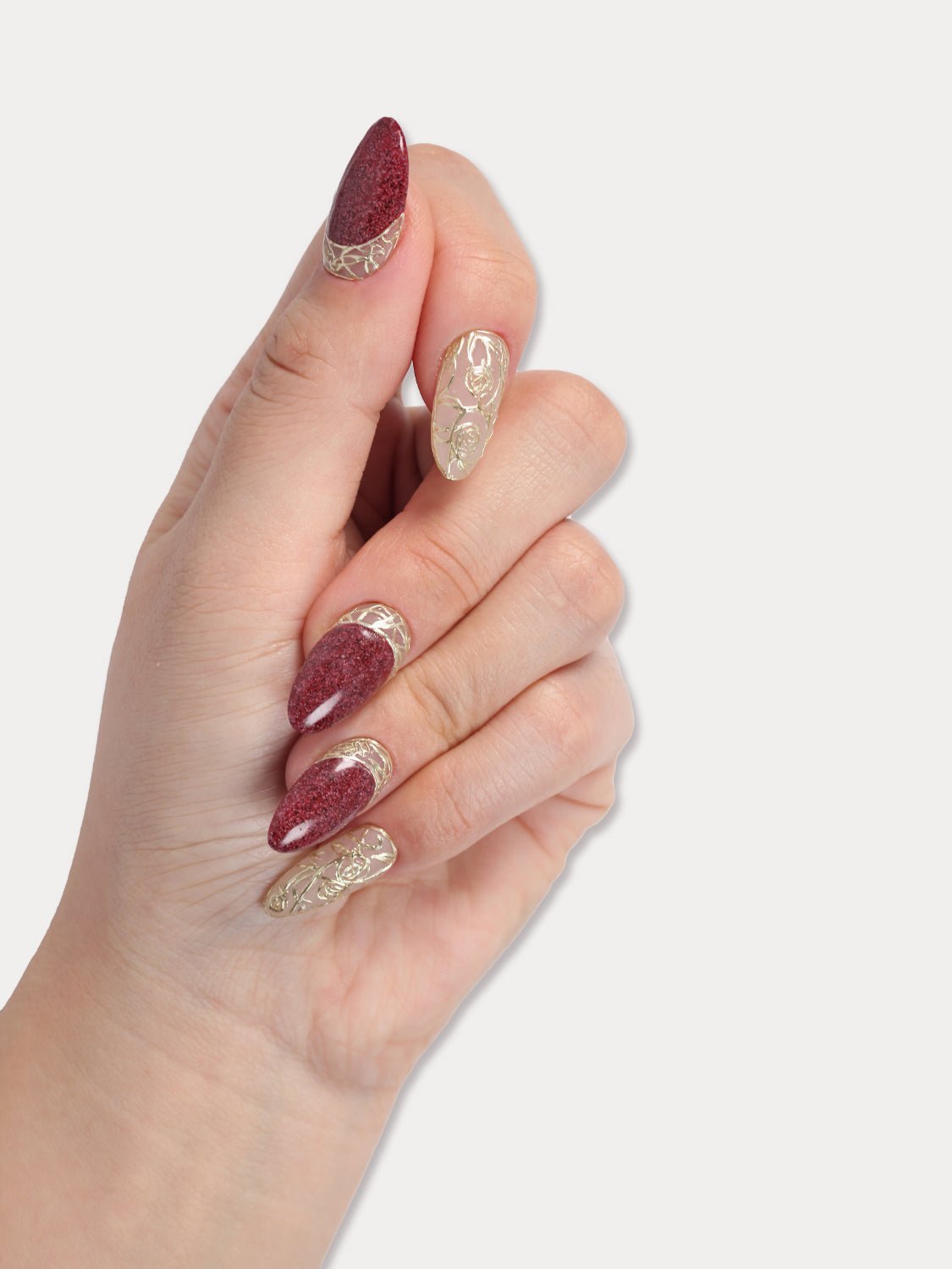 MIEAP Red Palace press on nails features intricate gold floral carvings and a red stone texture gel. The design showcases impeccable craftsmanship, while the stone texture exudes a sense of opulence and grandeur, reminiscent of a bygone era’s magnificence and sophistication. #MIEAP #MIEAPnails #pressonnail #falsenail #acrylicnail #nails #nailart #naildesign #nailinspo #handmadenail #autumnnail #nail2023 #graduationnail #shortnail #rednail #floralnail #datingnail #promnail