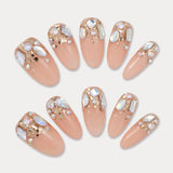 MIEAP Shiny Multi-Size Rhinestone press on nail set features an array of colorful rhinestones in various shapes, half-adorned at the cuticle area, complemented by a few larger glitter pieces. The nails refract different colors of light from every angle, creating a dazzling effect. #MIEAP #MIEAPnails #pressonnail #falsenail #acrylicnail #nails #nailart #naildesign #nailinspo #handmadenail #summernail #nail2023 #graduationnail #ovalnail #shortnail #rhinestonenail  #datingnail #promnail