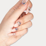 MIEAP Shiny Multi-Size Rhinestone press on nail set features an array of colorful rhinestones in various shapes, half-adorned at the cuticle area, complemented by a few larger glitter pieces. The nails refract different colors of light from every angle, creating a dazzling effect. #MIEAP #MIEAPnails #pressonnail #falsenail #acrylicnail #nails #nailart #naildesign #nailinspo #handmadenail #summernail #nail2023 #graduationnail #ovalnail #shortnail #rhinestonenail  #datingnail #promnail